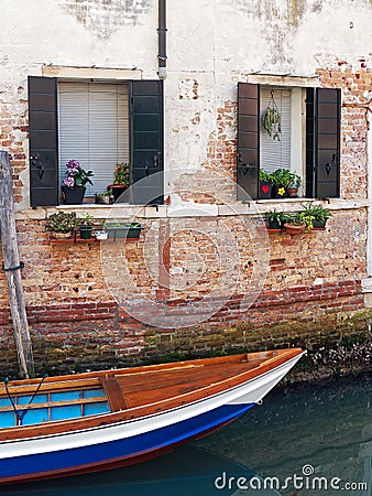 Colourful Wooden Boat in Venice Canal Stock Photo