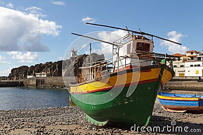 Colourful wooden fishing boat on beach Stock Photo