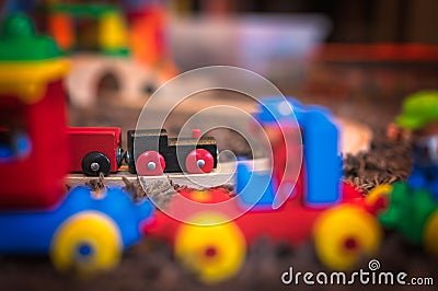 Wooden toy train on a room floor Stock Photo