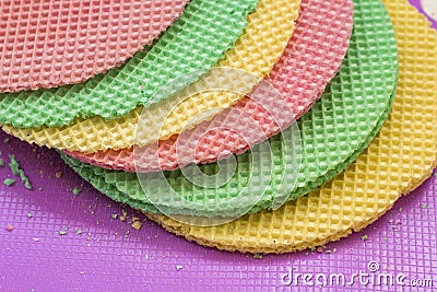 Colourfull waffles. Textured abstract background. Close up. Flat lay Stock Photo