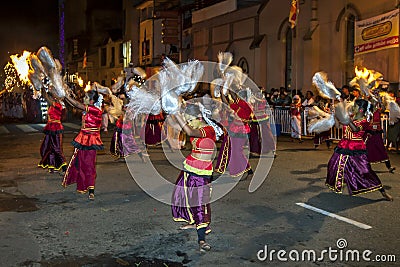 Colourfully dressed dancers at the Esala Perahera in Kandy, Sri Lanka. Editorial Stock Photo