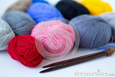 Colours balls of yarn and knitting needles on white background Stock Photo