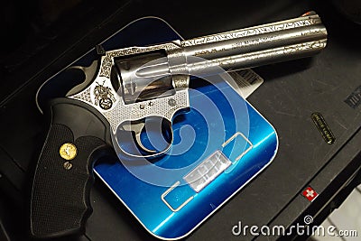 Colt Python 357 on a scale, beautiful powerful weapon Editorial Stock Photo