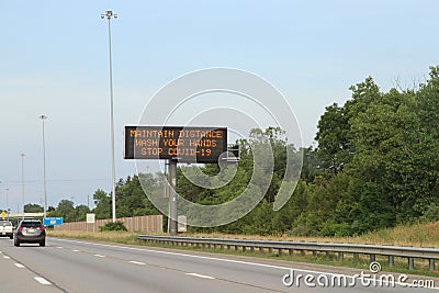 Freeway Amber Alert reminds passenger of Covid-19 safety precautions. Editorial Stock Photo