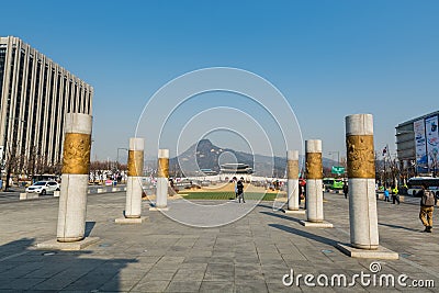 Columns next to Statue of the Sejong daewang, at the Gwanghwamun Square and background of Gyeongbokgung palace in Seoul of South Editorial Stock Photo