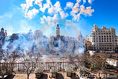 Columns of smoke from a mascleta, a typical daytime fireworks display during the Fallas of Valencia Editorial Stock Photo