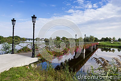 Flower bridge leading to Comana natural park Stock Photo