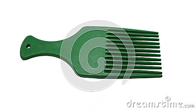 The comb is green on a white background. Designed to be used to comb hair after shampooing Stock Photo