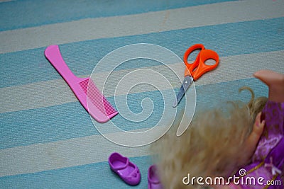 Comb,hair,doll and scissors Stock Photo