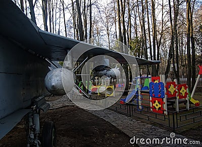 Combat aircraft near the children`s Playground in the Museum, Editorial Stock Photo