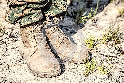 Combat boots in the desert Stock Photo