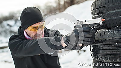 Combat gun tactical shooting behind and around cover or barricade Stock Photo