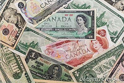 Combination of old Canadian and US paper currency. Editorial Stock Photo