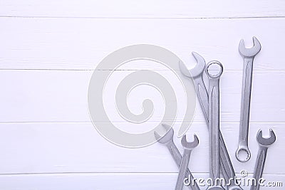 Combination wrenches for repair on white wooden background Stock Photo