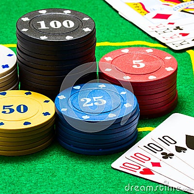 Combinations of playing cards and bright columns of poker chips Stock Photo