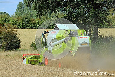 Combined Harvester in a wheat field. Editorial Stock Photo