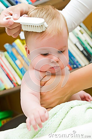 Combing baby Stock Photo