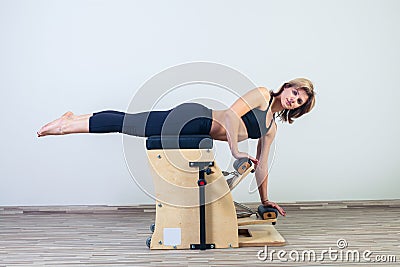 Combo wunda pilates chair woman fitness yoga gym Stock Photo