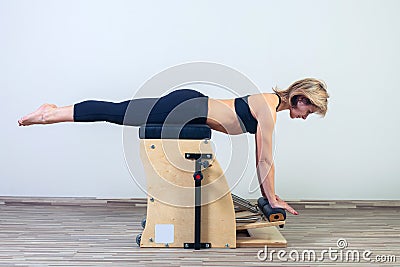 Combo wunda pilates chair woman fitness yoga gym Stock Photo