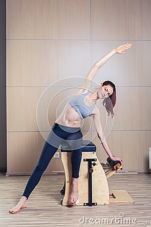 Combo wunda pilates chair woman fitness yoga gym Stock Photo