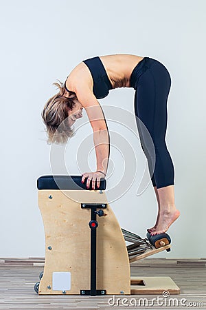 Combo wunda pilates chair woman fitness yoga gym Stock Photo