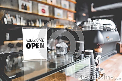 Come in we`re open in cafe owner open startup with cafe shop Stock Photo