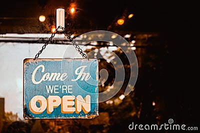 Come In We`re Open sign on door of cafe Stock Photo