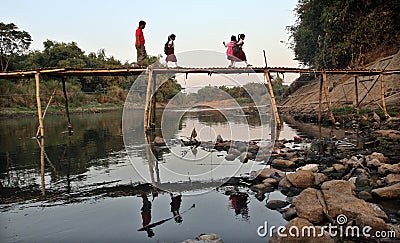 Come school, number of students crossing the bamboo bridge river river solo in the morning, Editorial Stock Photo