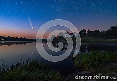 Comet C/2020 F3 Neowise in night sky over medieval Svirzh Castle, Lviv region, Ukraine Stock Photo