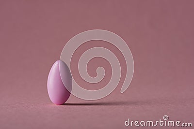 Comfit on pink background with shadows Stock Photo