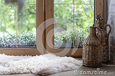 Sheepskin rug and home decor on wooden windowsill Stock Photo