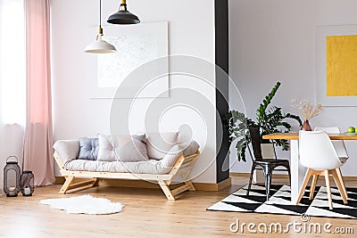 Couch standing beneath a painting Stock Photo