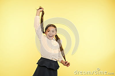 Comfortable and easy hairstyle. Deal with long hair hairstyle by yourself. Kid girl long ponytail hairstyle. Child Stock Photo