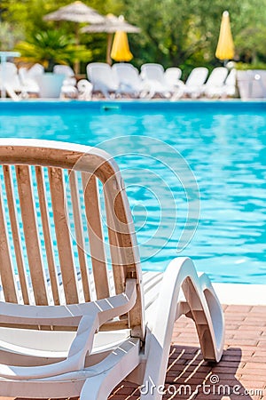 Comfortable recliner chair alongside a pool Stock Photo