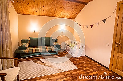 Comfortable small bed in cozy children`s bedroom Stock Photo