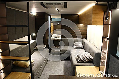 Comfortable sofas, cabinets and beds in rear part of large modern campervan Adria Astella, displayed on Caravan Expo in Nitra Editorial Stock Photo