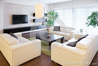 Comfortable white sofas Stock Photo