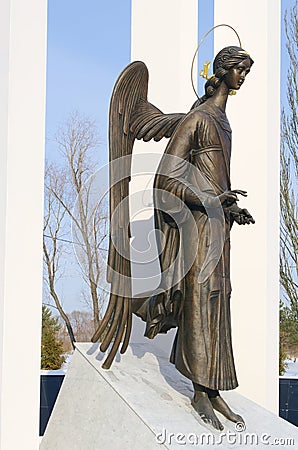 Comforting angel - fragment of monument to liquidators of Chernobyl accident. Omsk, Russia. Stock Photo