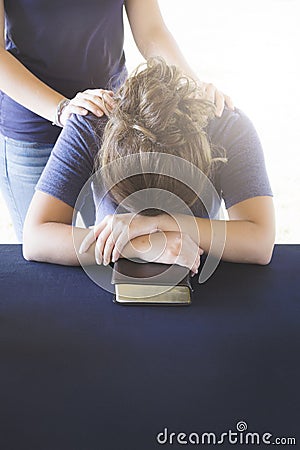 Comforting a Distressed Woman During a Bible Study Stock Photo