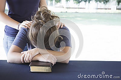 Comforting a Distressed Woman During a Bible Study Stock Photo