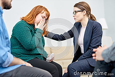 Comforting Patient During Group Therapy Session Stock Photo