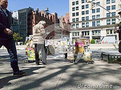 Comic book seller talking next to Flatiron building, new york Cartoon Illustration