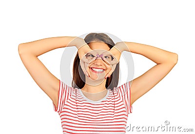 Comic crazy girl holding fingers near eyes like glasses and grimacing. emotional girl isolated on white background Stock Photo