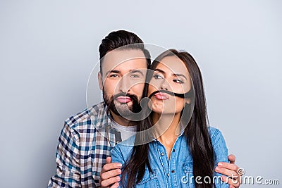 Comic, funky partners holding strand of hair with pout lips like Stock Photo