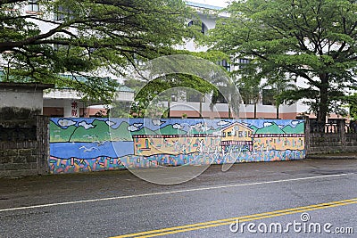 Comics wall of meilun junior high school in rain Editorial Stock Photo