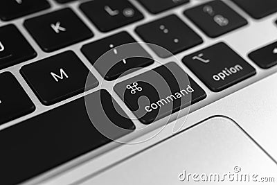 Command key and button on apple keyboard. Command sign close-up. Modern laptop, communication concept photo Editorial Stock Photo