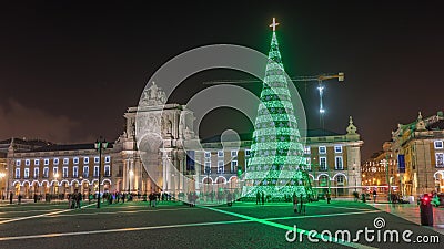 Commerce square illuminated and decorated at Christmas time in Lisbon night timelapse hyperlapse Editorial Stock Photo