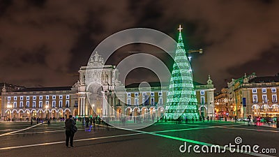 Commerce square illuminated and decorated at Christmas time in Lisbon night timelapse hyperlapse Editorial Stock Photo