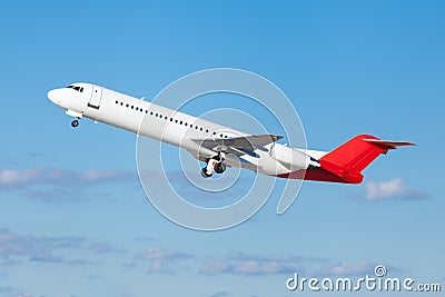 Commercial airliner flying midair after takeoff Stock Photo