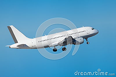 Commercial airliner flying midair after takeoff Stock Photo